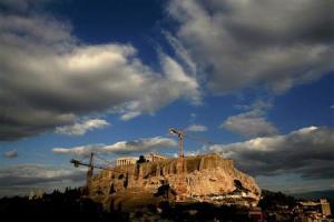 File picture of cranes at foothills of Acropolis during transfer operation of artefacts from Acropolis to new location some 400 meters away in Athens